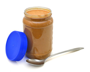 Jar of peanut butter isolated on a white background