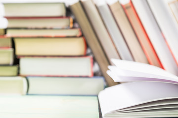 Pile of various books on wooden background