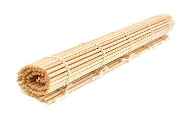 rolled bamboo mat on a white background