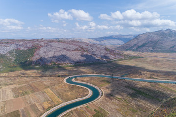 Aerial view to the valley and the Trebishnica river in the Bosnia and Hercegovina mountains.