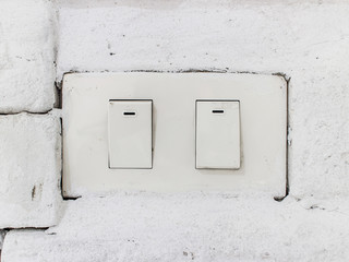 light switch on old brick wall