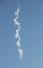 vapor trail left in sky by rocket launch