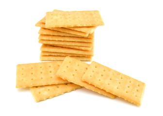 Salty crackers in square shape on white background