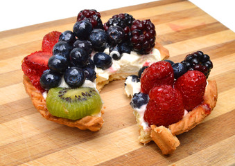 Fresh fruit tart on wooden board