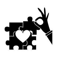 Obraz premium puzzle pieces heart love with hand icon image vector illustration design black and white