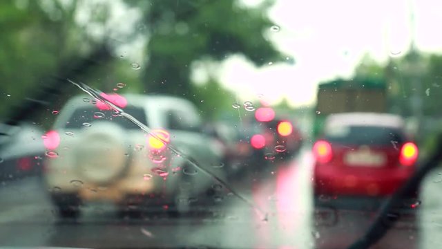 The windscreen wiper removes rain drops from the windshield