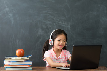 female student sitting in blackboard background