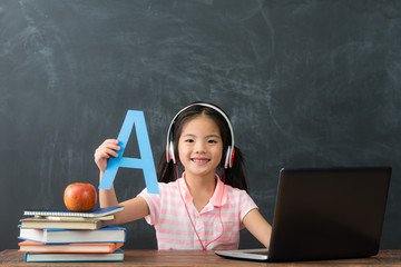 girl student using online e-learning studying