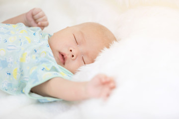 Close-up of asian baby boy sleeping .