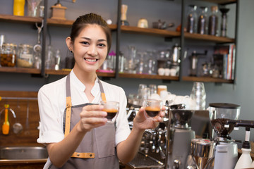 Asian Barista woman making Coffee with coffee machine in the coffee shop. people with barista in cafe concept.