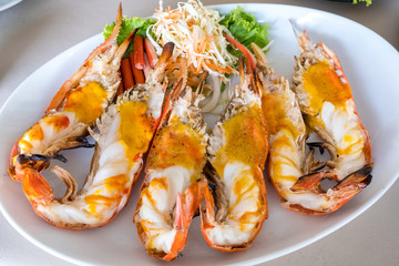 Roasted big river shrimp on the white plate , Selective focus.