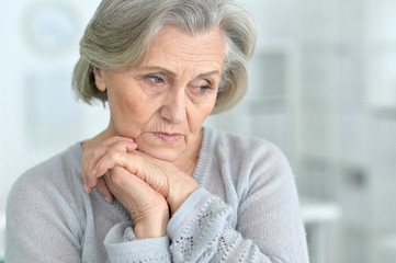 Beautiful sad elderly woman close-up