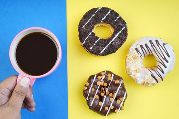 Assorted donuts served on a pastel background
