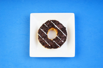 Assorted donuts served on a pastel background