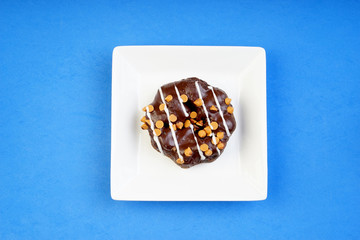 Assorted donuts served on a pastel background