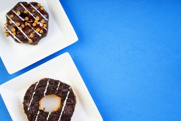 Assorted donuts served on a pastel background