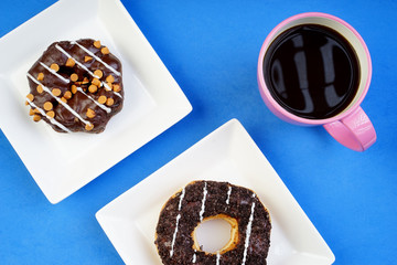 Assorted donuts served on a pastel background