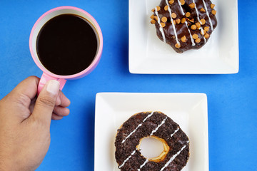Assorted donuts served on a pastel background