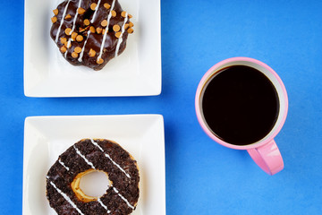 Assorted donuts served on a pastel background