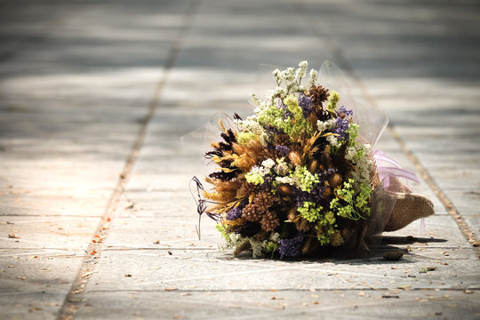 Bouquet on the floor because of disappointment.