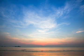 Naklejka na ściany i meble Blue sky during sunset on the sea beach.