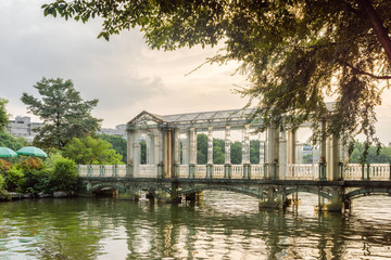 Wonderful glass bridge on lake in park at sunset, Guilin