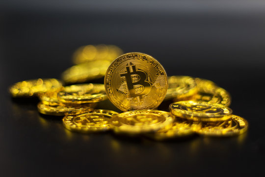 Gold Bitcoin on black background. Concept electronic money in future.