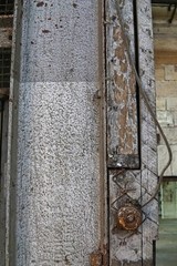 Grain image of old switch on old wood texture backgrounds. A rustic light switch button on wall.