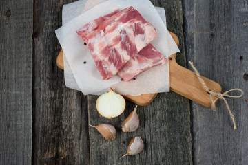 fresh pork ribs on a cutting Board, wooden background