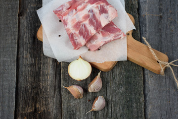 fresh pork ribs on a cutting Board, wooden background