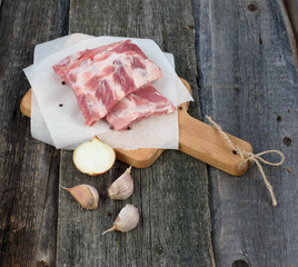 fresh pork ribs on a cutting Board, wooden background