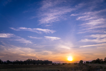 sunset over farm