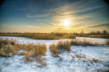 The frozen river. Morning. The sun