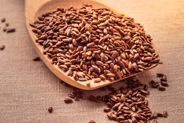 Flax seeds linseed on wooden spoon
