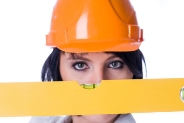 Measuring level over woman in helmet background. Focus on tool