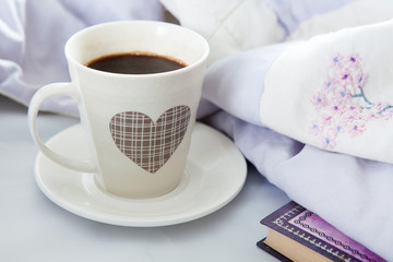 Bedroom on the bed, morning coffee. Valentine's Day. Happiness. A heart.