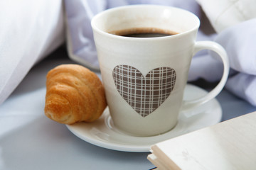 Bedroom on the bed, morning coffee. Valentine's Day. Happiness. A heart.