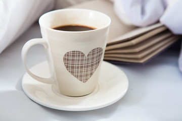 Bedroom on the bed, morning coffee. Valentine's Day. Happiness. A heart.