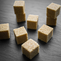 sugar cubes on a dark background. close up view