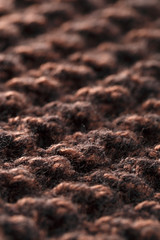 Background of woolen filaments of brown color.