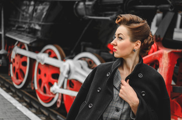 Obraz na płótnie Canvas girl on the platform of the railway station