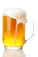 cold mug of beer with foam isolated on white background
