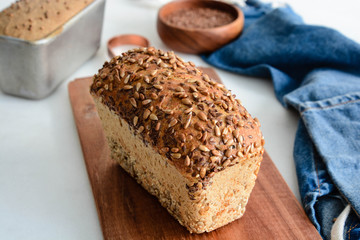 Homemade multi-grain bread on a wooden board.