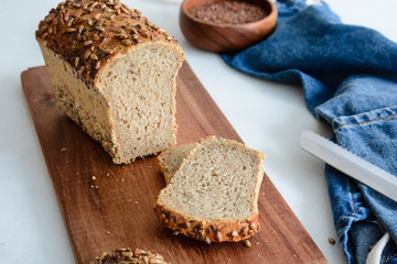 Homemade multi-grain bread on a wooden board.