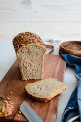 Homemade multi-grain bread on a wooden board.