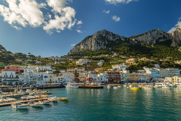 Fototapeta premium Beautiful landscape of Capri Island, Italy on a sunny day. View on the bay and Marina Grande harbor