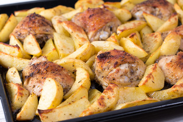 Potatoes with chicken baked in the oven. Delicious dish for dinner.