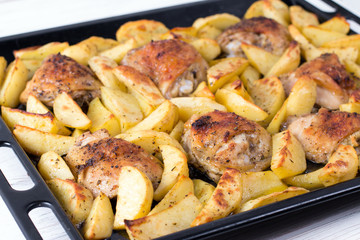 Potato with a hen on grill. Delicious dish for dinner.