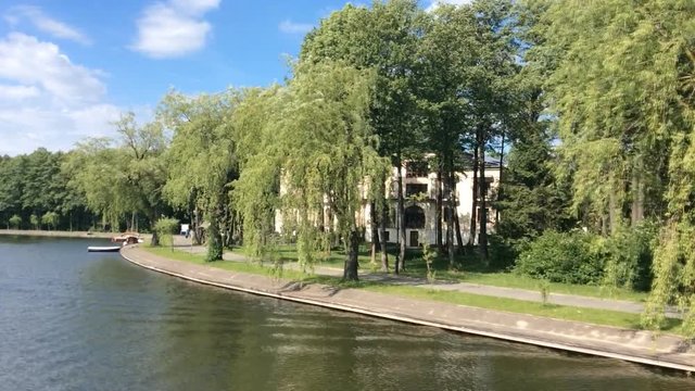 View from the bow of a narrowboat as it passes through an August w Canal