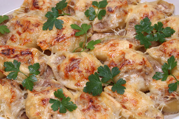 Italian pasta Conchiglioni Rigati stuffed with meat. Sprinkled with cheese. casserole. background